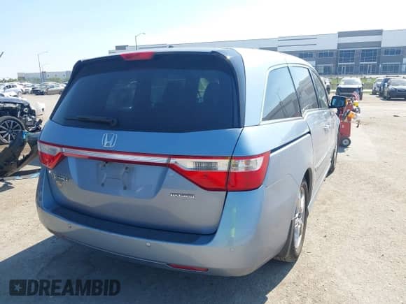 2012 Honda Odyssey Touring with VIN 5FNRL5H97CB130670, listed as a IAAI auction lot 43438076 with 198,047 mi miles and . Bid and sale history available at DreamBid. Image 4.