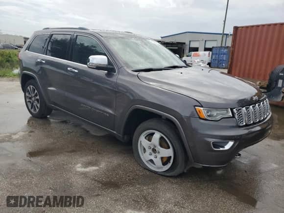 2017 Jeep Grand Cherokee Overland with VIN 1C4RJECG5HC605538, listed as a Copart auction lot 81946415 with 100,658 mi miles and Salvage title. Bid and sale history available at DreamBid. Image 4.