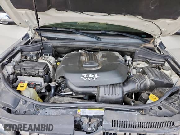 2012 Jeep Grand Cherokee Limited z VIN 1C4RJFBG0CC314672, wystawiony jako Copart lot #80743195 z przebiegiem 123 504 mil mil oraz Szkoda całkowita • Salvage title. Historia ofert i sprzedaży dostępna na DreamBid. Obrazek 11.