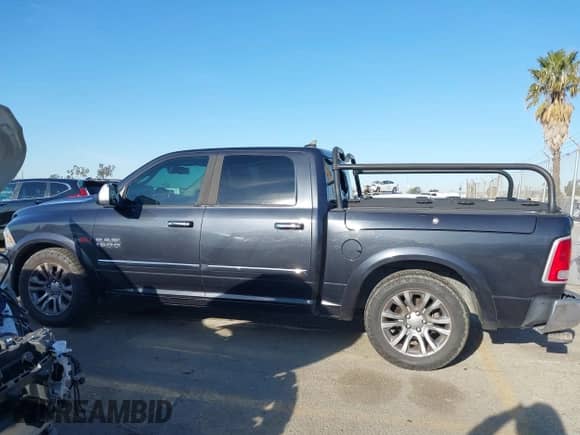 2015 Ram 1500 Laramie Longhorn с VIN 1C6RR7PM5FS714242, выставлен на аукционе IAAI как лот 41831312 с пробегом 130 616 миль миль и . История ставок и продаж доступна на DreamBid. Изображение 14.