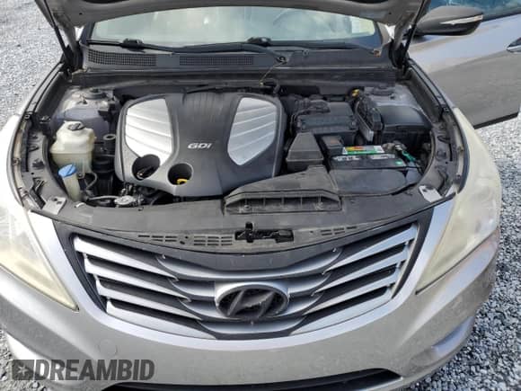 2013 Hyundai Azera z VIN KMHFH4JG1DA230468, wystawiony jako Copart lot #68003885 z przebiegiem 147 684 mil mil oraz Szkoda całkowita • Salvage title. Historia ofert i sprzedaży dostępna na DreamBid. Obrazek 11.