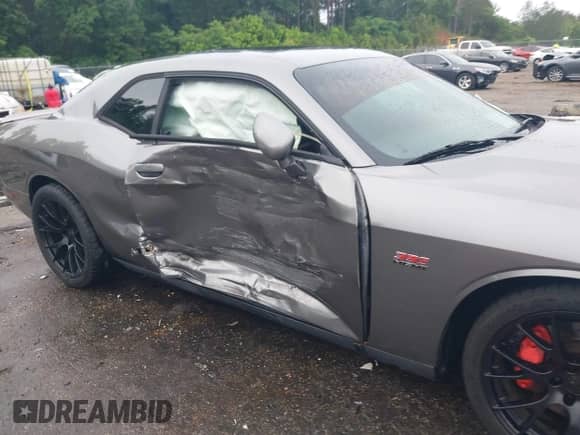 2012 Dodge Challenger SRT-8 392 with VIN 2C3CDYCJ5CH122880, listed as a IAAI auction lot 42165109 with 103,973 mi miles and . Bid and sale history available at DreamBid. Image 6.