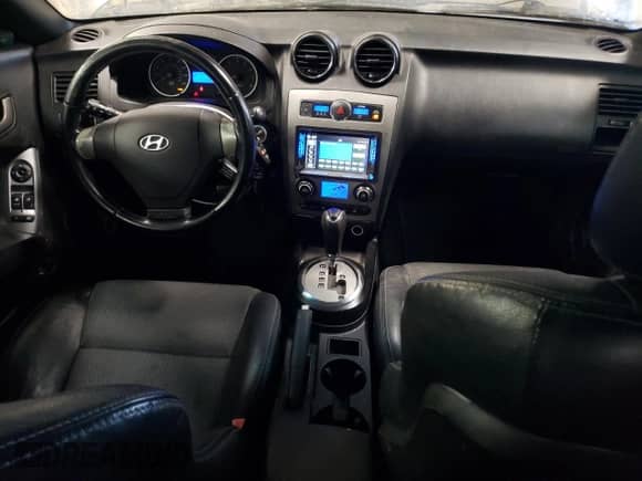 2008 Hyundai Tiburon GT with VIN KMHHN66F38U279074, listed as a Copart auction lot 87723645 with 125,280 mi miles and Salvage title. Bid and sale history available at DreamBid. Image 8.