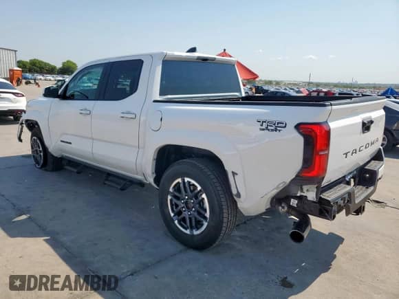 2025 Toyota Tacoma SR5 with VIN 3TMKB5FNXSM036779, listed as a Copart auction lot 68123025 with 557 mi miles and Salvage title. Bid and sale history available at DreamBid. Image 2.