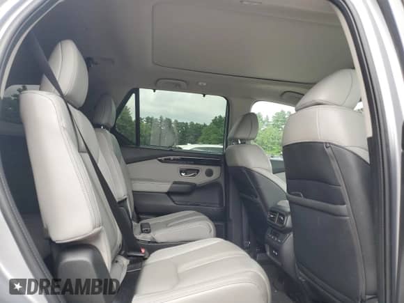 2023 Honda Pilot Touring z VIN 5FNYG1H78PB012799, wystawiony jako Copart lot #64933945 z przebiegiem 31 834 mil mil oraz Szkoda całkowita • Salvage title. Historia ofert i sprzedaży dostępna na DreamBid. Obrazek 11.