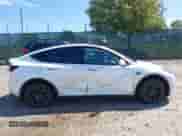 2023 Tesla Model Y Long Range with VIN 7SAYGDEE9PA033911, listed as a IAAI auction lot 43202182 with 35,938 mi miles and . Bid and sale history available at DreamBid. Image 13.