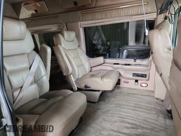 2002 Ford Econoline Cargo Recreational with VIN 1FDRE14L42HB76262, listed as a Copart auction lot 66448265 with 99,825 mi miles and Salvage title. Bid and sale history available at DreamBid. Image 11.