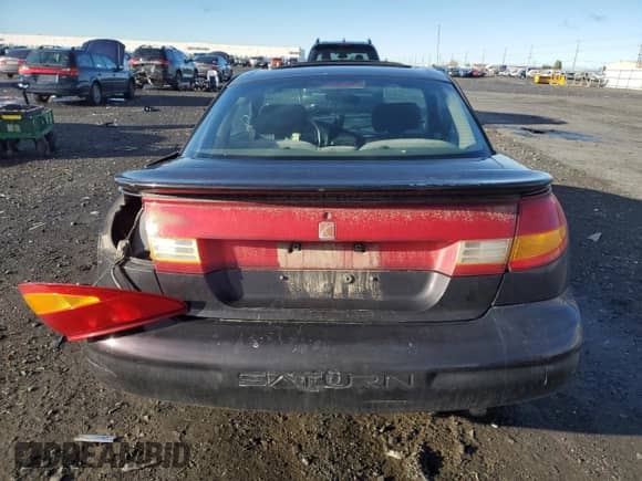 2000 Saturn SC с VIN 1G8ZY1273YZ152453, выставлен на аукционе Copart как лот 84834784 с пробегом Не указан миль и Списание • Salvage title. История ставок и продаж доступна на DreamBid. Изображение 6.