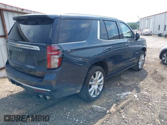 2021 Chevrolet Tahoe High Country with VIN 1GNSKTKL0MR124242, listed as a IAAI auction lot 42370020 with 61,394 mi miles and . Bid and sale history available at DreamBid. Image 4.