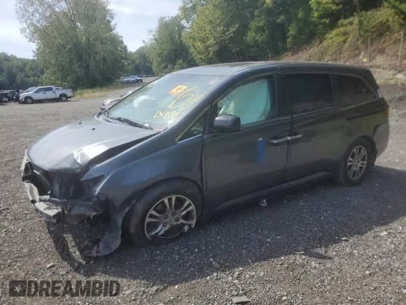 2013 Honda Odyssey EX-L with VIN 5FNRL5H65DB029618, listed as a Copart auction lot 70712485 with 195,097 mi miles and Salvage title. Bid and sale history available at DreamBid. Image 1.