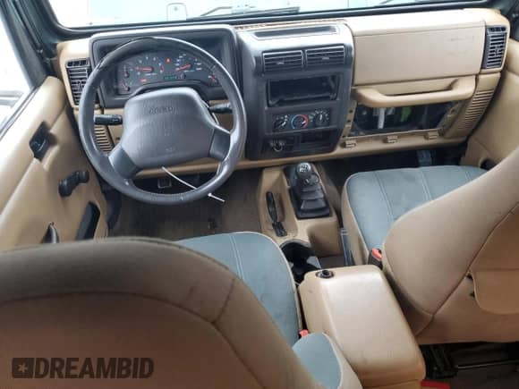 2001 Jeep Wrangler Sahara z VIN 1J4FA59S21P349009, wystawiony jako Copart lot #64310995 z przebiegiem 87 642 mil mil oraz Czysty tytuł • Clean title. Historia ofert i sprzedaży dostępna na DreamBid. Obrazek 8.