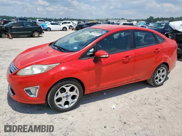 2012 Ford Fiesta SEL with VIN 3FADP4CJ2CM103825, listed as a Copart auction lot 67818615 with 142,234 mi miles and Salvage title. Bid and sale history available at DreamBid. Image 1.