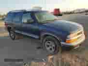 1999 Chevrolet Blazer LS z VIN 1GNCS13W9X2194269, wystawiony jako Copart lot #75468004 z przebiegiem 154 501 mil mil oraz Szkoda całkowita • Salvage title. Historia ofert i sprzedaży dostępna na DreamBid. Obrazek 4.