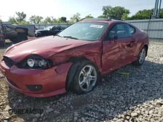 2006 Hyundai Tiburon GT с VIN KMHHN65FX6U190598, выставлен на аукционе Copart как лот 61143675 с пробегом Не указан миль и Списание • Salvage title. История ставок и продаж доступна на DreamBid. Изображение 1.