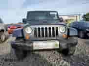 2008 Jeep Wrangler Sahara с VIN 1J8FA541X8L519597, выставлен на аукционе Copart как лот 83830965 с пробегом 141 463 миль миль и Списание • Salvage title. История ставок и продаж доступна на DreamBid. Изображение 5.