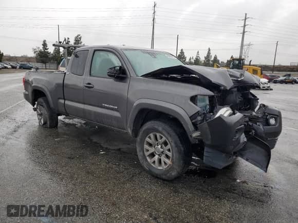 2018 Toyota Tacoma SR5 with VIN 5TFRZ5CN3JX065967, listed as a Copart auction lot 45059415 with 94,321 mi miles and Salvage title. Bid and sale history available at DreamBid. Image 4.