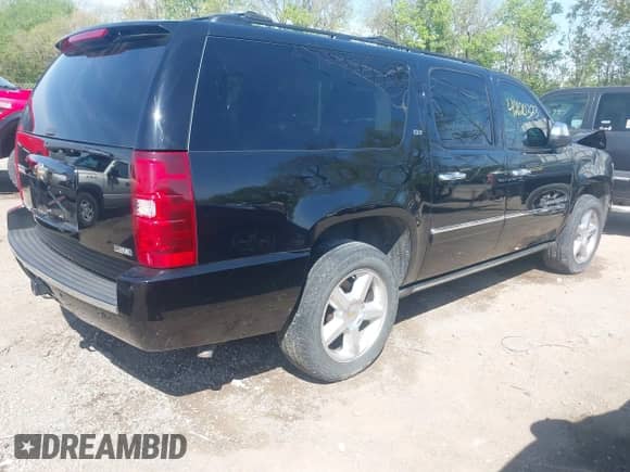 2009 Chevrolet Suburban LTZ z VIN 1GNFK36359R219818, wystawiony jako IAAI lot #42120323 z przebiegiem 146 999 mil mil oraz . Historia ofert i sprzedaży dostępna na DreamBid. Obrazek 4.