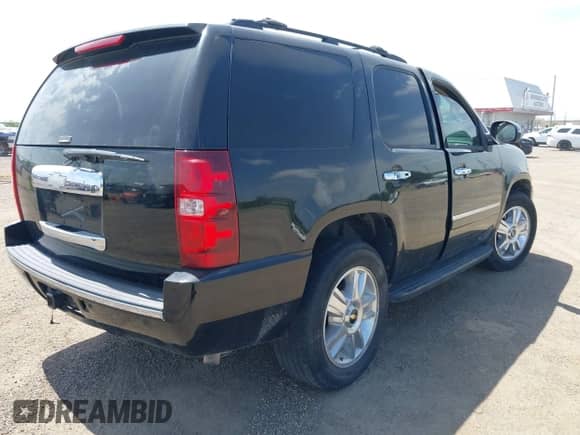 2009 Chevrolet Tahoe LTZ with VIN 1GNFC33J09R172584, listed as a IAAI auction lot 42762889 with 229,534 mi miles and . Bid and sale history available at DreamBid. Image 4.