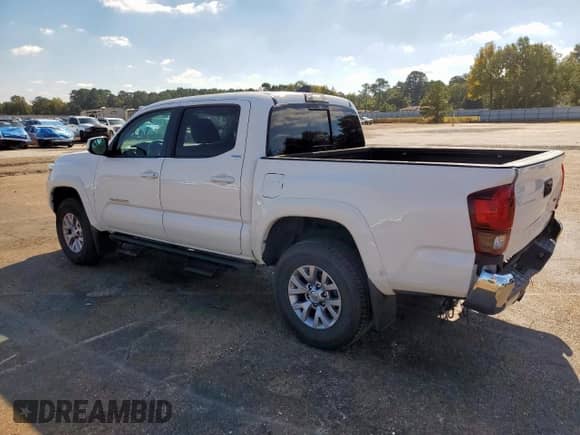 2019 Toyota Tacoma SR5 with VIN 5TFAZ5CN1KX085228, listed as a Copart auction lot 82779455 with 91,822 mi miles and Salvage title. Bid and sale history available at DreamBid. Image 2.