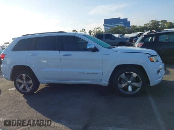 2015 Jeep Grand Cherokee Overland z VIN 1C4RJECG6FC848840, wystawiony jako IAAI lot #43513815 z przebiegiem 92 993 mil mil oraz . Historia ofert i sprzedaży dostępna na DreamBid. Obrazek 13.