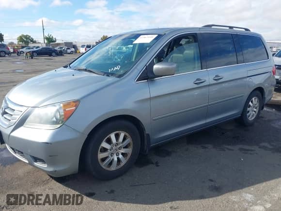 2008 Honda Odyssey EX-L with VIN 5FNRL38628B104477, listed as a IAAI auction lot 43363199 with 220,595 mi miles and . Bid and sale history available at DreamBid. Image 17.