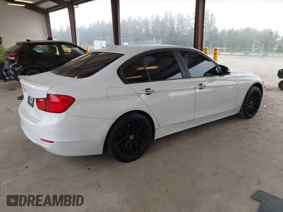 2014 BMW 3 Series 328i with VIN WBA3C1C57EK117469, listed as a IAAI auction lot 43207455 with 77,275 mi miles and . Bid and sale history available at DreamBid. Image 4.