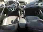 2013 Hyundai Veloster w/Black Int с VIN KMHTC6ADXDU159174, выставлен на аукционе Copart как лот 67471915 с пробегом 146 394 миль миль и Списание • Salvage title. История ставок и продаж доступна на DreamBid. Изображение 8.