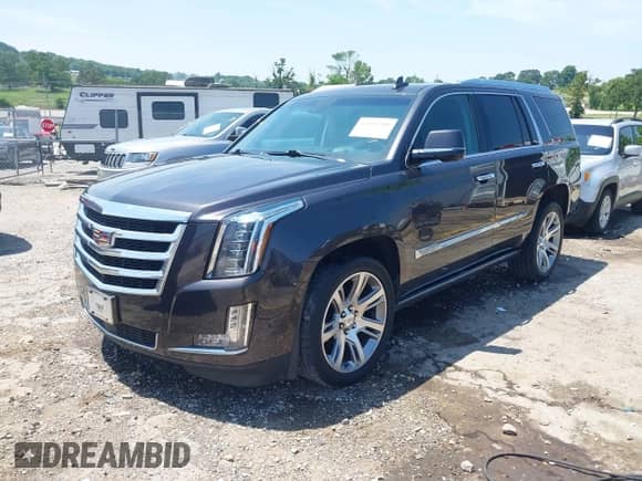 2017 Cadillac Escalade Premium Luxury z VIN 1GYS4CKJ6HR351341, wystawiony jako IAAI lot #42453288 z przebiegiem 162 798 mil mil oraz . Historia ofert i sprzedaży dostępna na DreamBid. Obrazek 2.