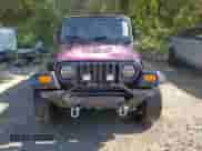 2000 Jeep Wrangler SE with VIN 1J4FA29P8YP784721, listed as a Copart auction lot 82079075 with 157,084 mi miles and Clean title. Bid and sale history available at DreamBid. Image 5.