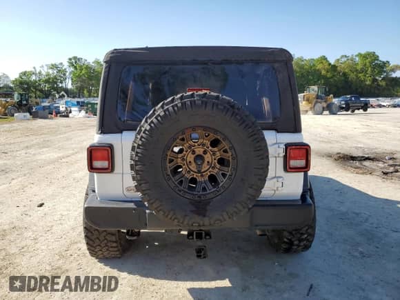 2023 Jeep Wrangler Sport with VIN 1C4HJXDG0PW507228, listed as a Copart auction lot 50957255 with Not provided miles and Non repairable. Bid and sale history available at DreamBid. Image 6.