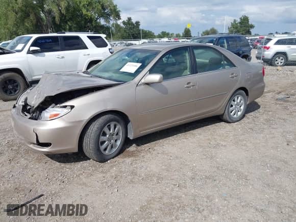 2002 Toyota Camry XLE with VIN JTDBF30K220032817, listed as a IAAI auction lot 43221406 with 108,631 mi miles and . Bid and sale history available at DreamBid. Image 2.