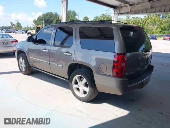 2011 Chevrolet Tahoe LTZ with VIN 1GNSCCE09BR333023, listed as a IAAI auction lot 43085215 with 165,616 mi miles and . Bid and sale history available at DreamBid. Image 3.