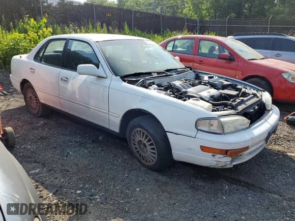 1992 Toyota Camry z VIN 4T1VK12E0NU015172, wystawiony jako Copart lot #58974095 z przebiegiem 210 163 mil mil oraz Szkoda całkowita • Salvage title. Historia ofert i sprzedaży dostępna na DreamBid. Obrazek 4.