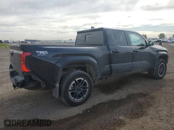 2024 Toyota Tacoma SR5 with VIN 3TYLB5JN2RT055045, listed as a Copart auction lot 69134065 with 25,584 mi miles and Salvage title. Bid and sale history available at DreamBid. Image 3.