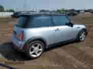 2004 MINI Hardtop with VIN WMWRC33454TJ56308, listed as a Copart auction lot 59690865 with 99,374 mi miles and Salvage title. Bid and sale history available at DreamBid. Image 3.