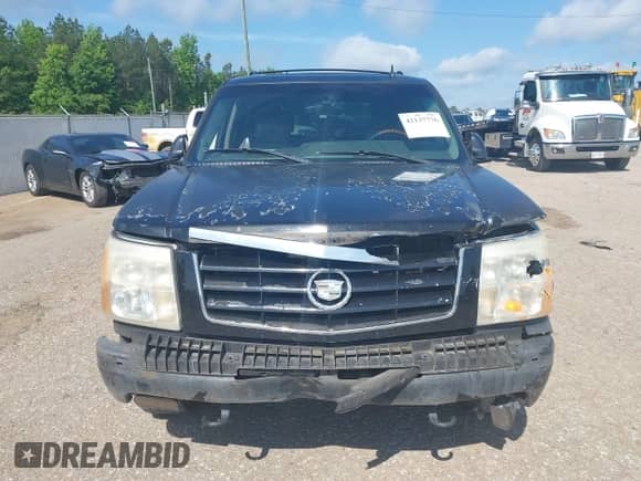 2006 Cadillac Escalade z VIN 1GYEC63N76R155487, wystawiony jako IAAI lot #42137776 z przebiegiem 420 278 mil mil oraz . Historia ofert i sprzedaży dostępna na DreamBid. Obrazek 12.