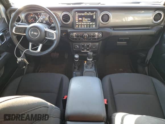 2023 Jeep Wrangler Sahara Altitude with VIN 1C4HJXEG1PW601584, listed as a Copart auction lot 84018874 with 12,003 mi miles and Salvage title. Bid and sale history available at DreamBid. Image 8.