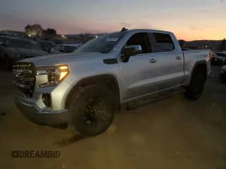 2021 GMC Sierra 1500 SLE with VIN 3GTP8BEK5MG392178, listed as a Copart auction lot 84557424 with 65,960 mi miles and Salvage title. Bid and sale history available at DreamBid. Image 1.