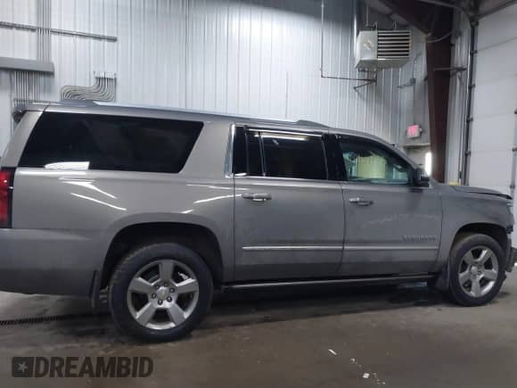 2018 Chevrolet Suburban Premier z VIN 1GNSKJKC9JR100134, wystawiony jako IAAI lot #41449255 z przebiegiem 111 528 mil mil oraz . Historia ofert i sprzedaży dostępna na DreamBid. Obrazek 13.