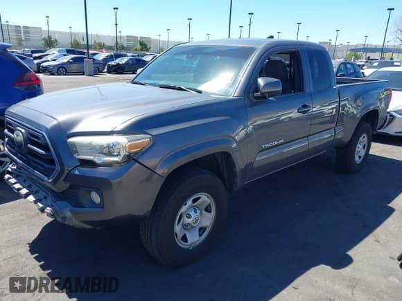 2018 Toyota Tacoma SR with VIN 5TFRX5GN1JX118441, listed as a IAAI auction lot 41870266 with 95,612 mi miles and . Bid and sale history available at DreamBid. Image 2.