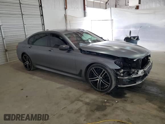 2017 BMW 7 Series 750i with VIN WBA7F0C31HGM22359, listed as a Copart auction lot 56306875 with 90,642 mi miles and Salvage title. Bid and sale history available at DreamBid. Image 4.