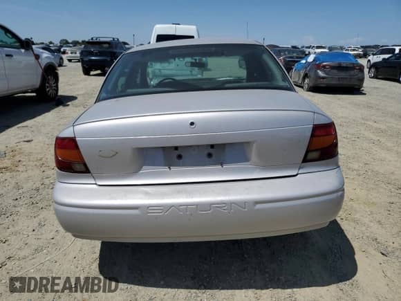 2000 Saturn SL with VIN 1G8ZH5280YZ121421, listed as a Copart auction lot 58169285 with 226,014 mi miles and Salvage title. Bid and sale history available at DreamBid. Image 6.
