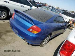 2004 Hyundai Tiburon GT с VIN KMHHN65F94U133810, выставлен на аукционе Copart как лот 63740764 с пробегом 131 180 миль миль и Списание • Salvage title. История ставок и продаж доступна на DreamBid. Изображение 3.