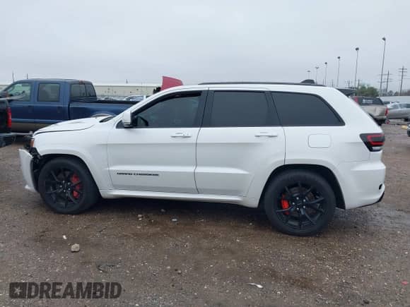 2016 Jeep Grand Cherokee SRT with VIN 1C4RJFDJ0GC456325, listed as a IAAI auction lot 41425211 with 159,746 mi miles and . Bid and sale history available at DreamBid. Image 14.