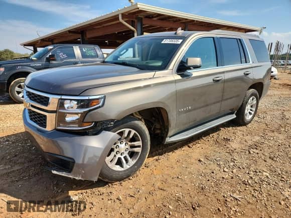 2015 Chevrolet Tahoe LT with VIN 1GNSCBKC4FR657138, listed as a Copart auction lot 81708335 with 129,145 mi miles and Salvage title. Bid and sale history available at DreamBid. Image 1.