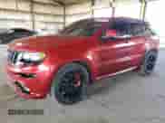 2014 Jeep Grand Cherokee SRT-8 z VIN 1C4RJFDJ2EC100276, wystawiony jako Copart lot #61185445 z przebiegiem 117 391 mil mil oraz Czysty tytuł • Clean title. Historia ofert i sprzedaży dostępna na DreamBid. Obrazek 1.