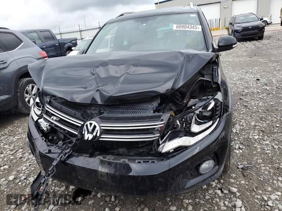 2014 Volkswagen Tiguan SEL with VIN WVGAV3AX7EW101796, listed as a Copart auction lot 60904345 with 97,652 mi miles and Salvage title. Bid and sale history available at DreamBid. Image 5.