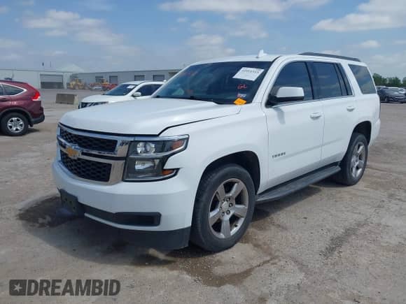 2017 Chevrolet Tahoe LS with VIN 1GNSCAKC3HR219434, listed as a IAAI auction lot 41911513 with 164,967 mi miles and . Bid and sale history available at DreamBid. Image 2.