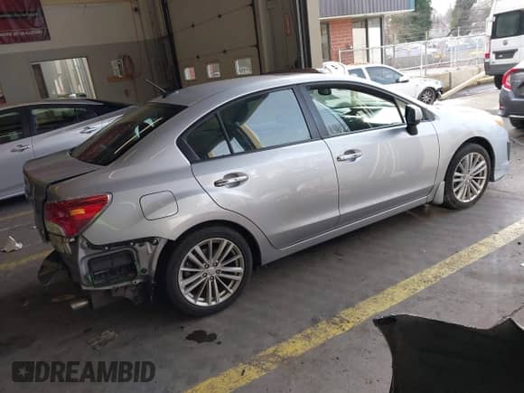 2012 Subaru Impreza Limited z VIN JF1GJAK69CH017703, wystawiony jako IAAI lot #41623080 z przebiegiem 53 105 mil mil oraz . Historia ofert i sprzedaży dostępna na DreamBid. Obrazek 4.