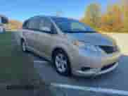 2012 Toyota Sienna LE AAS with VIN 5TDKK3DC9CS233451, listed as a Copart auction lot 87127545 with 220,725 mi miles and Clean title. Bid and sale history available at DreamBid. Image 1.